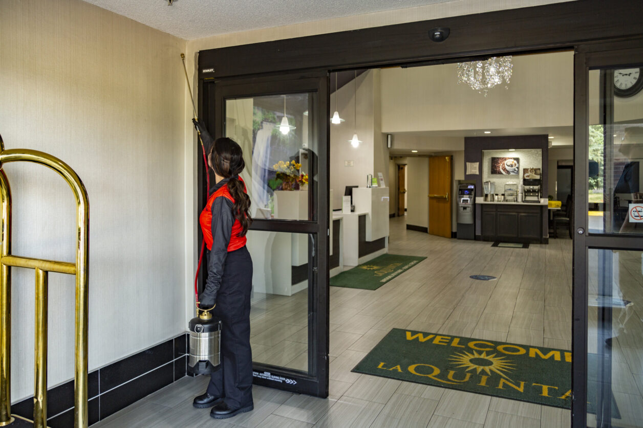 Tech treating entrance to hotel