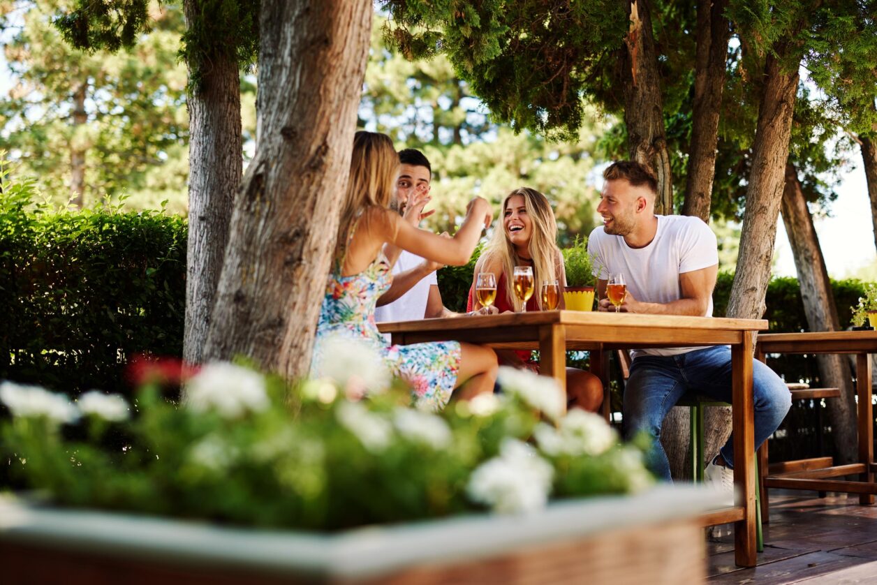 young couple enjoying drinks outside